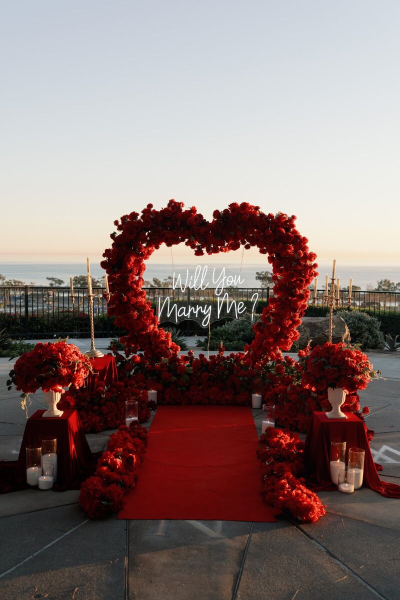 Red heart arch with neon sign